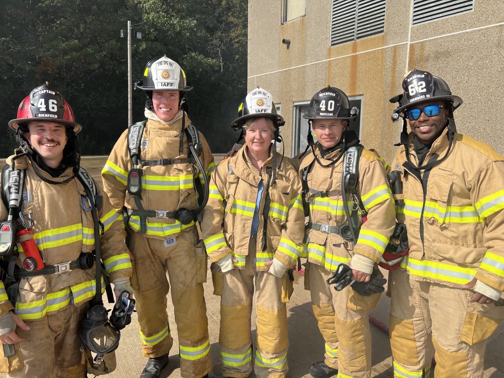 Sean Hayford Oleary and Mary Supple participating in IAFF Fire Ops 101, where elected officials try some of the training tasks of local firefighters.
